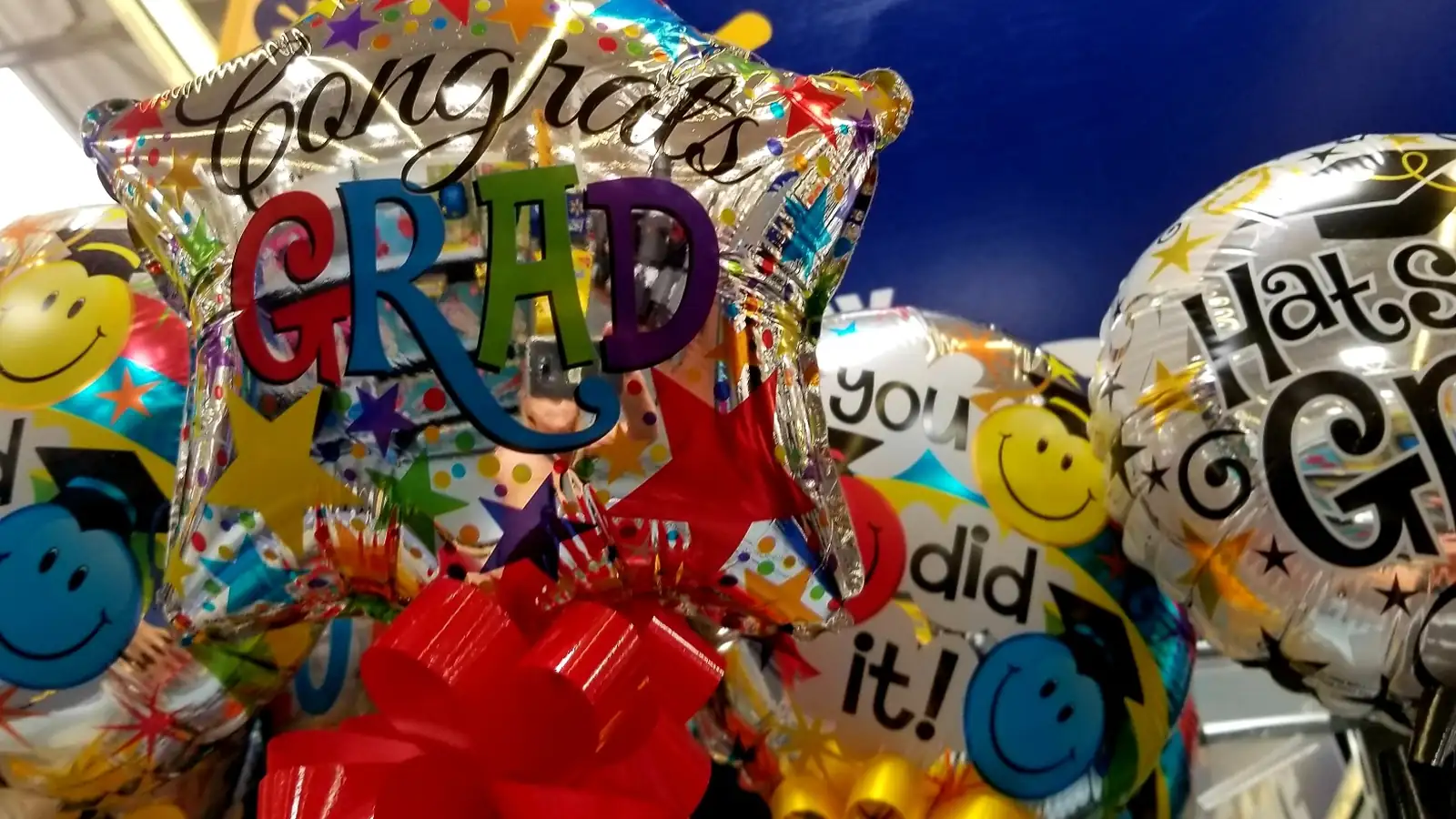 Colorful congratulations balloons and decorations for an 8th grade graduation party celebration