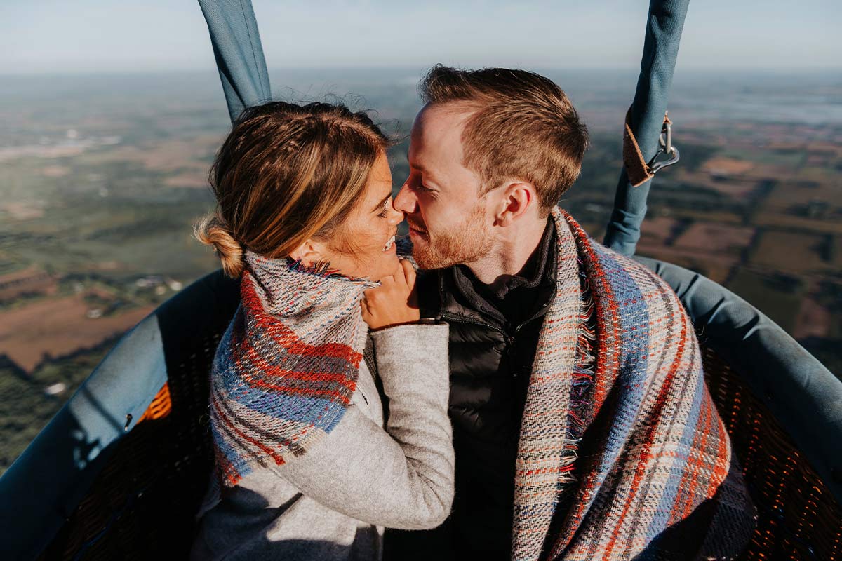 20 something Newly engaged couple in a hot air balloon during their engagement