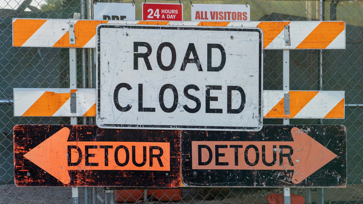 An outside road closed detour sign 