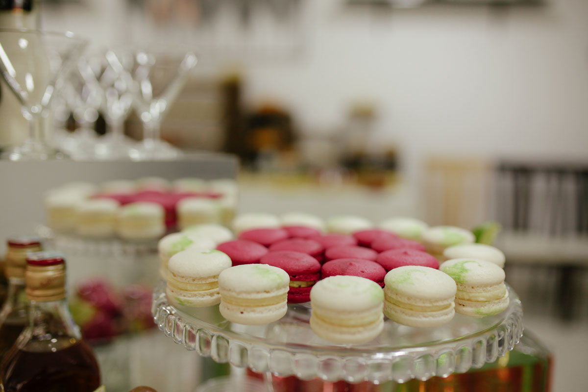 Table display of macarons providing an elegant dessert option for guests.