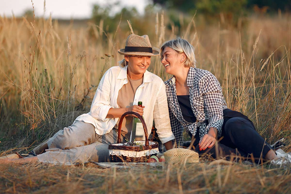 Elegant middle age women in an autumn wheat field enjoying the outdoors