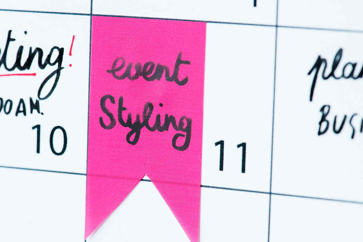 Event styling text written on a calendar and highlighted in pink