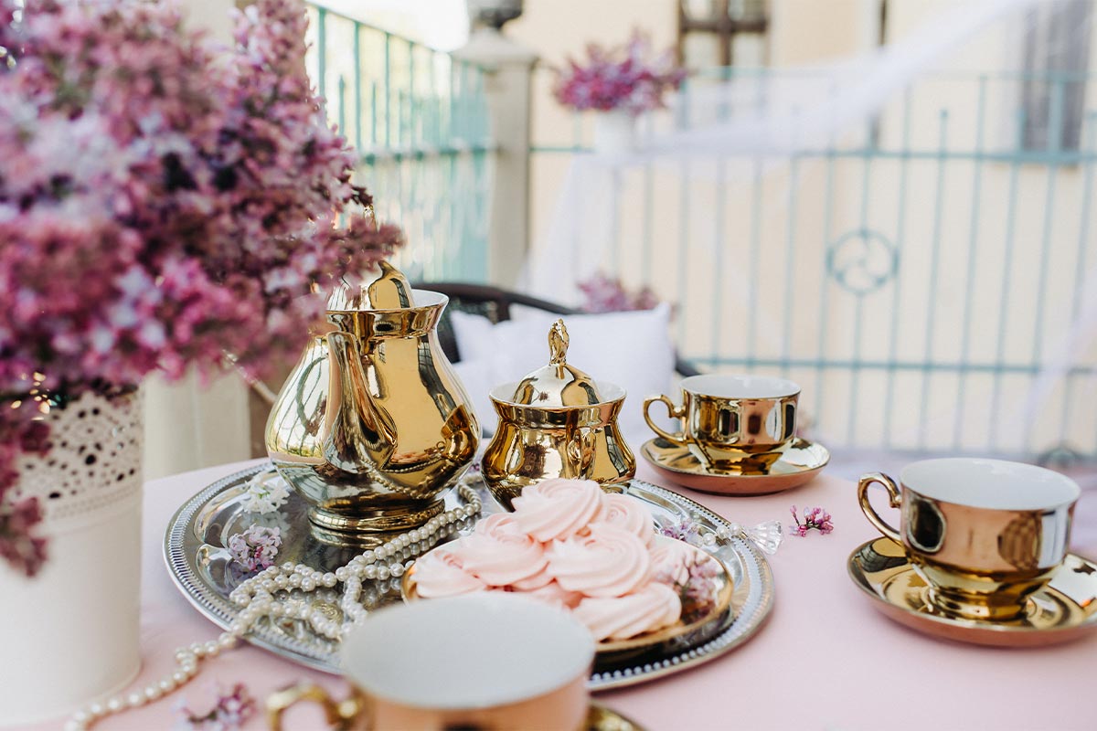 Gold kettle pot placed on the table 