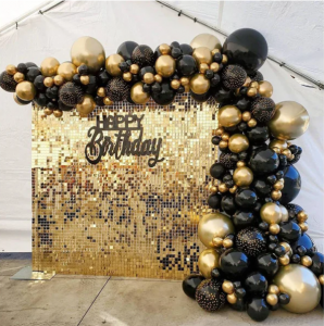 black and gold balloons with gold metallic backdrop