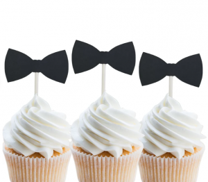 black bow tie cupcake toppers on white cupcakes